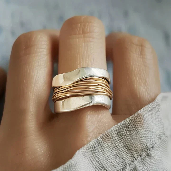 Silver Ring Adorned with Golden Threads